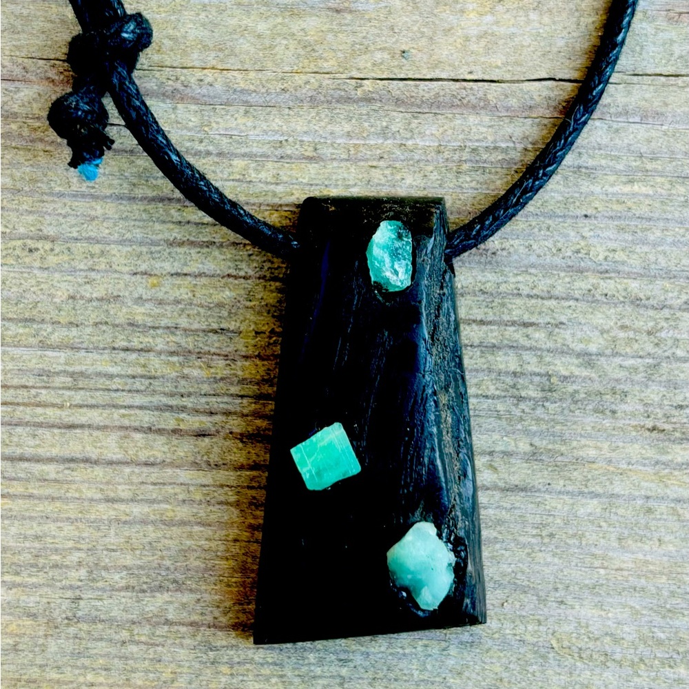 Ancient oak pendant with three raw high quality emeralds from Colombia
